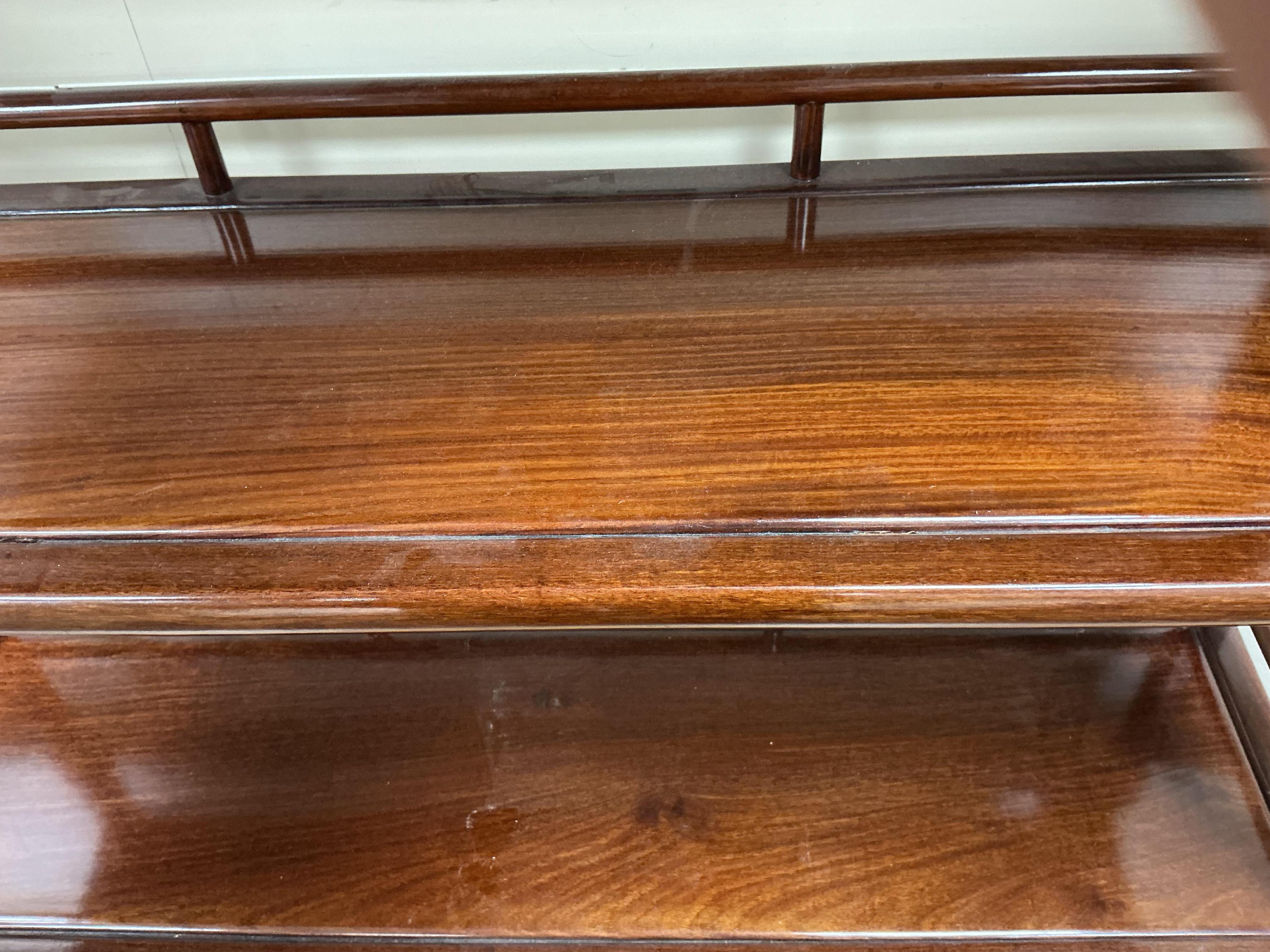 A Chinese hardwood open bookcase, width 100cm, depth 30cm, height 195cm